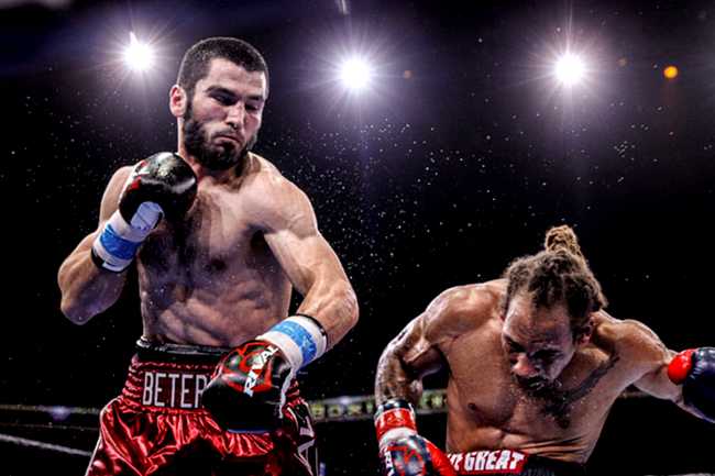 Artur Beterbiev punching an opponent with his left hand