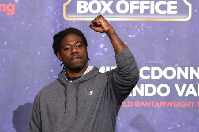 Charles Martin punching the air at a weight in