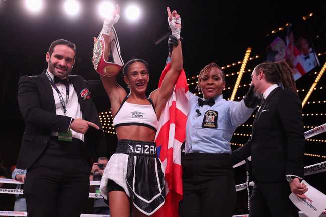 Amanda Serrano celebrating in the ring after a fight