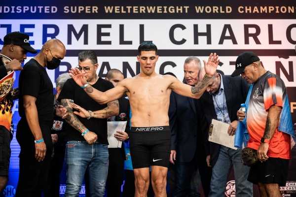 Brian Castano standing on a stage in his underwear at a weigh in