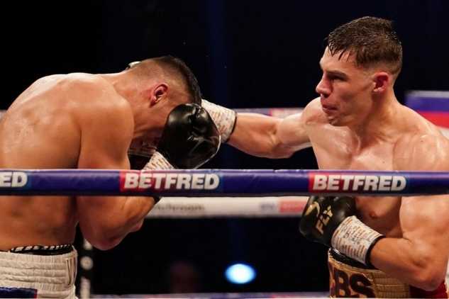 Chris Billam-Smith punching an opponent with a straight right